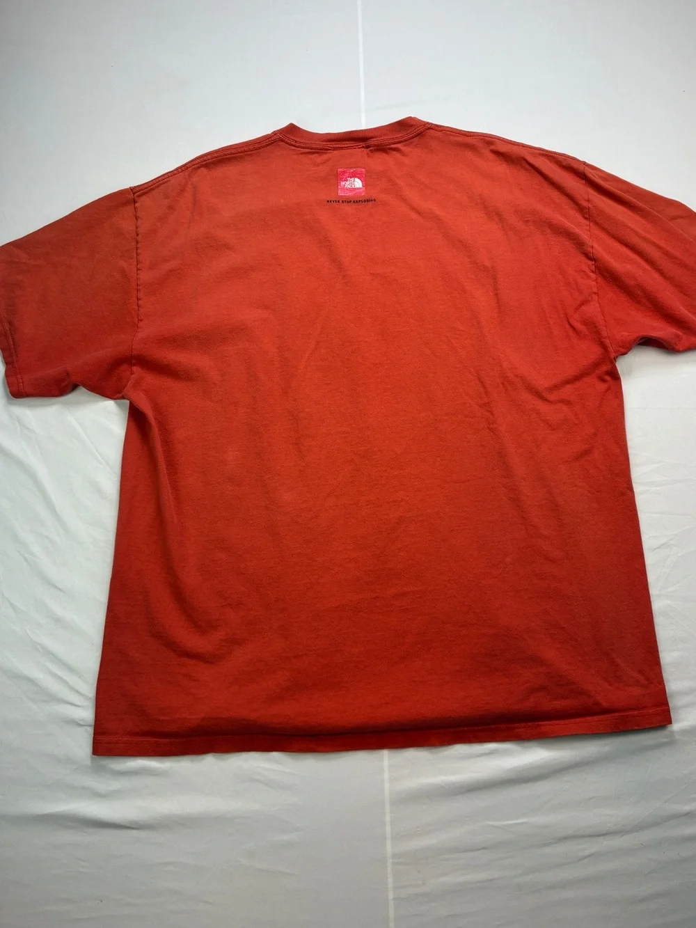 The North Face Red/Orange Short Sleeve Tee with Chest Stripe Graphic